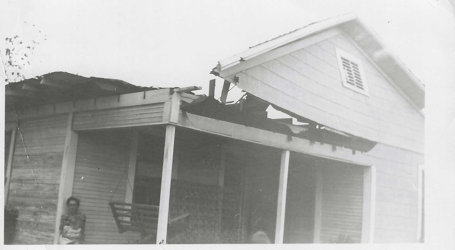 Historic black and white photograph of a building associated with early community history